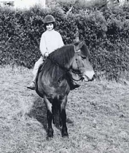 9 year old Cynthia and her first pony, Jingles.